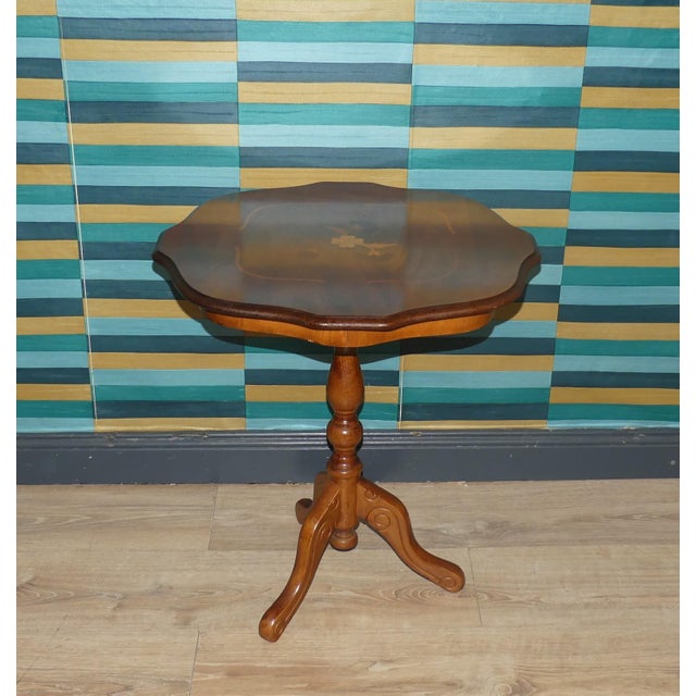 Charming coffee/side table with beautifully curved legs in the Chippendale style Round tabletop with ornately shaped edges...
