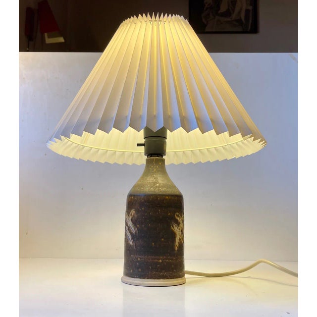 Stoneware table lamp by the Danish ceramist Per Engstrom. It is executed in stoneware glazed in an earthy brown color. It...