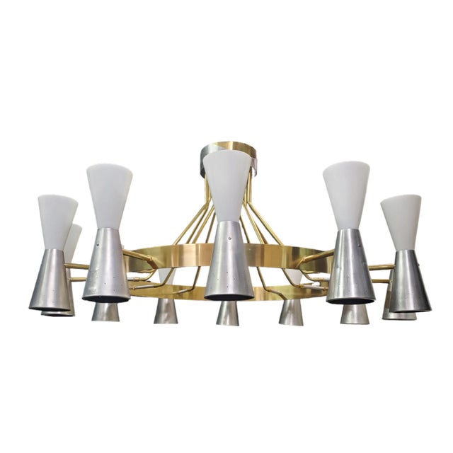 This imposing and majestic original Mid-century Modern chandelier features a substantial 12-arm/24-light design. A broad...