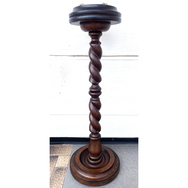 Elegant, free-standing ashtray made of oak wood, with a decorative twisted column and a glass insert. Dimensions: Height:...
