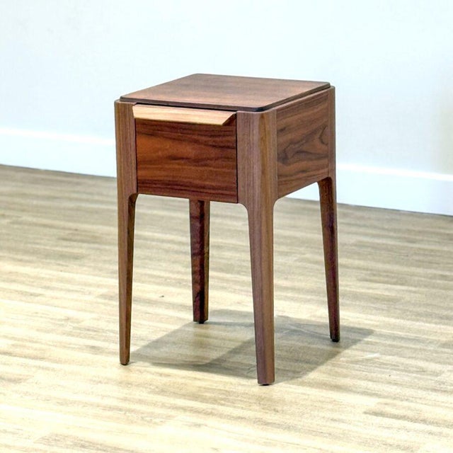 The Ziggy dining table by Porada , designed by Carlo Ballabio , is a graceful celebration of fine Italian woodworking....