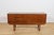 This compact sideboard was manufactured in the United Kingdom during the 1960s. The piece is distinguished by its elegant,...