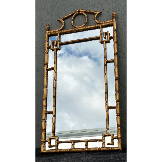 This is a mirror that is being reproduced in metal and composition. This is the real thing. This is a solid gilt wood faux...