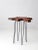 Striking mid-century accent table featuring a sculptural live-edge burl top with an intriguingly abstract, ink-blot-like...