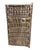 This vintage Dogon granary door from Mali features intricate carved relief figures—standing Nommo ancestors , breasts...