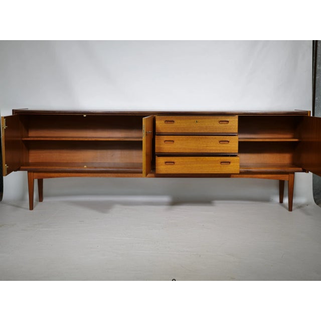 German wooden sideboard from Bartels, 1960s sideboard with rectangular top, made entirely of wood. On one side it has a...
