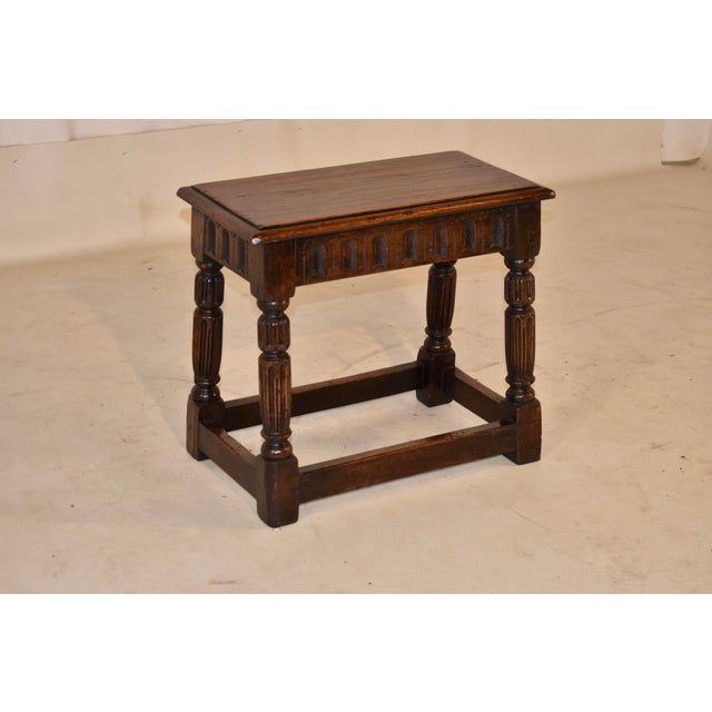 Late 19th century oak and elm joint stool from England. The top is made from elm, and has a lovely warm color and beveled...