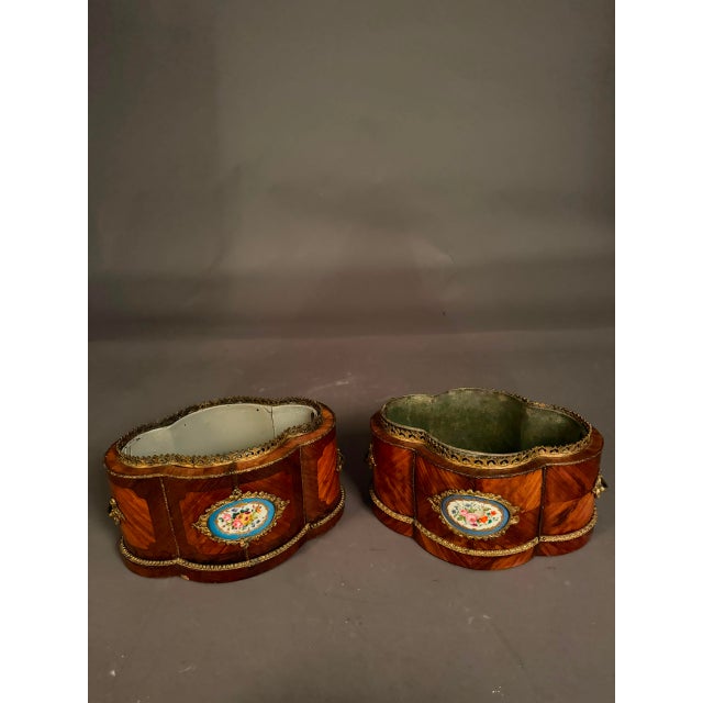 Elegant and unusual pair of French Louis XV style jardinières dating to circa 1890. These decorative indoor flower...