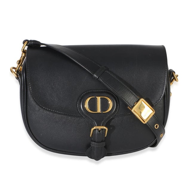 Item #: 154281 Features Interior: One card slot. One slip pocket Dimensions: 8.5 x 7.5 x 2 in Handbag Closure Type:...