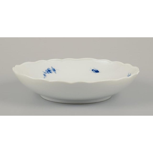 Meissen, Germany. Large porcelain bowl. Hand-painted with floral motifs and insects in blue. 1920s/30s. Marked. First...