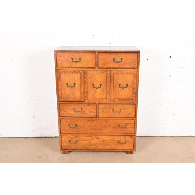 A gorgeous Mid-Century Modern Campaign style highboy dresser or gentleman's chest By Henredon, "Artefacts" Collection USA,...