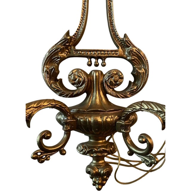 14” tall 11” wide This exquisite vintage double-arm wall sconce is a masterpiece of Neoclassical design. Crafted with...