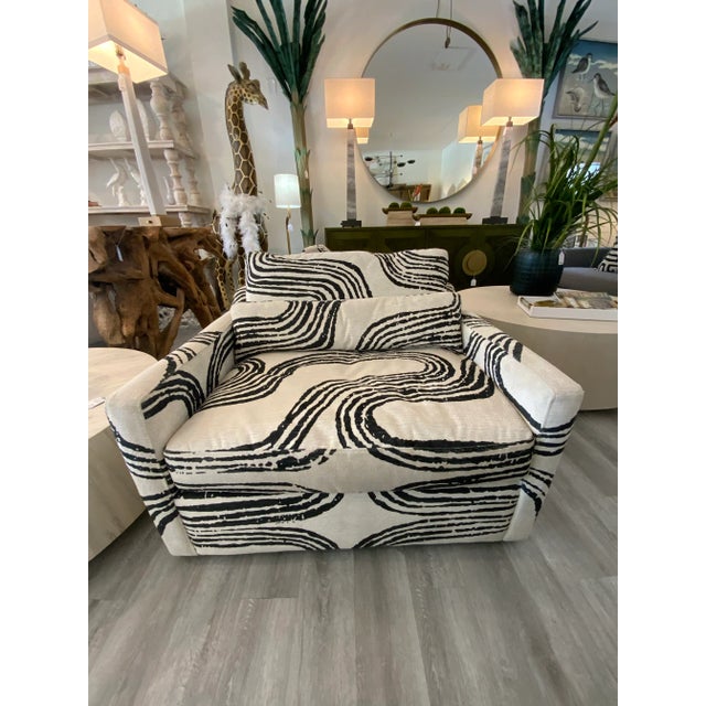 With its oversized seat, lumbar support pillow (included), comfortable sloped arm construction, and swivel base, you will...