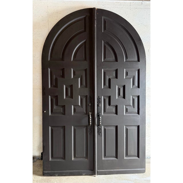 This is an incredible set of 8 foot tall solid wood arched double doors. The doors were salvaged from an old church, and...