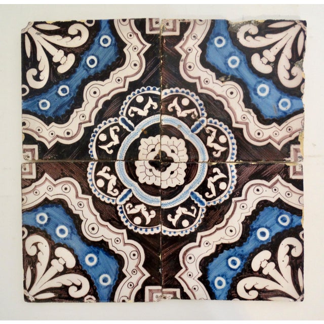 A set of 4 hand painted porcelain Dutch Delft tiles in an unusual kaleidoscope pattern. These faience tiles can be...
