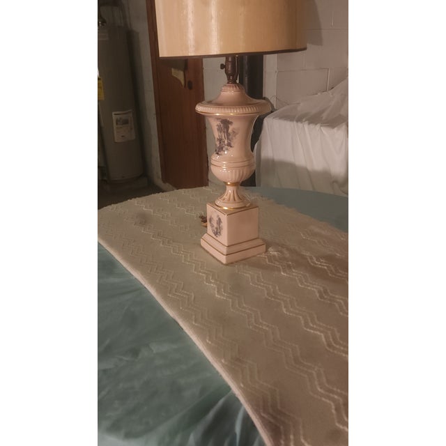 Elegant Mid-Century Modern porcelain lamp with gold trim and hand painted scenes. Fully functional, fine condition.