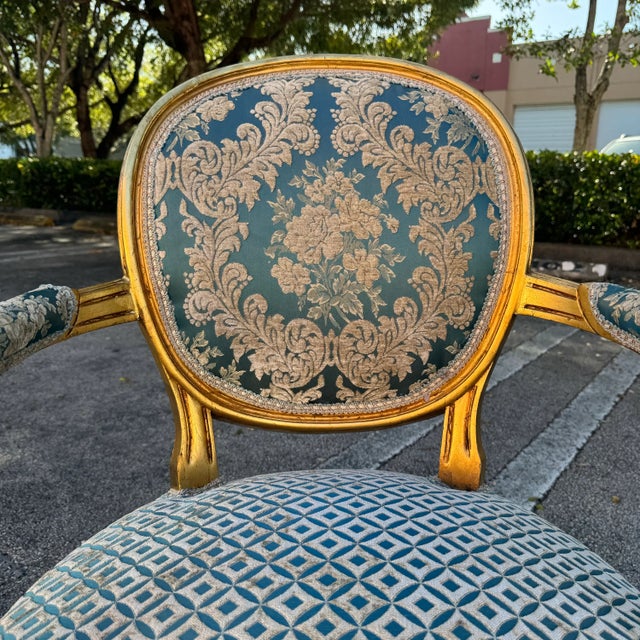 Elevate your space with this stunning French Rococo-style armchair. Fully refinished with 24K gold leaf accents and...