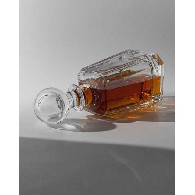 This vintage Murano glass decanter from the 1990s is a striking example of sculptural Italian design. Crafted from very...