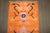 A mi 20th century Bright Orange Color Tibetan rug with a floral design