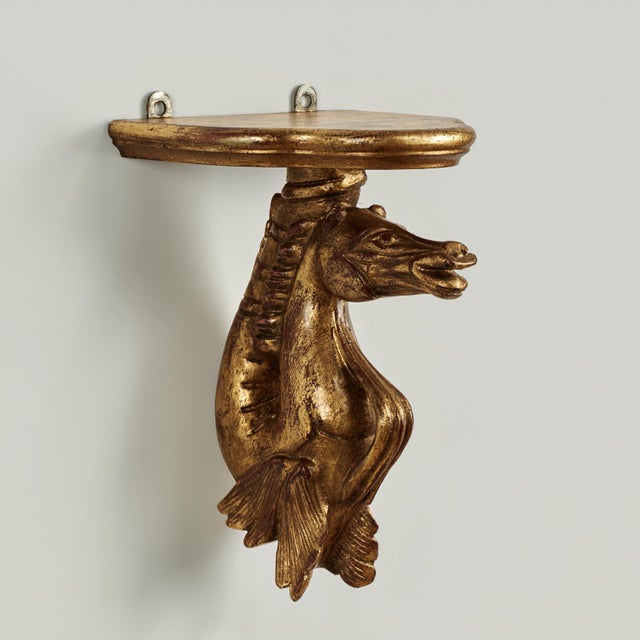 Lofty group of four antique neo classic wall brackets hand carved in walnut having a beveled shelf over a stylized grotto...