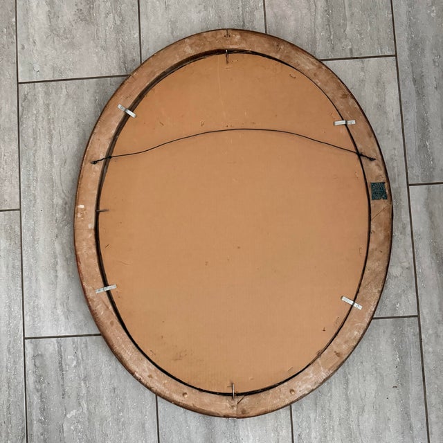 An unsigned portrait of a woman with a lavier necklace featured prominently. The sticker on the back is a clue this is...