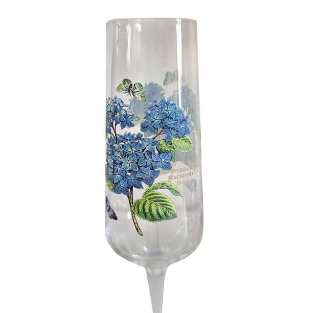 A set of three Vintage Portmeirion Botanical Garden Stemmed 8oz Champagne Flutes featuring floral motifs of Hydrangea,...