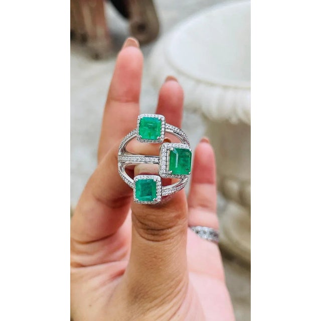 This is part of Chairish’s Fine Jewelry assortment. Designer emerald three stone ring in 14K gold with diamonds which...