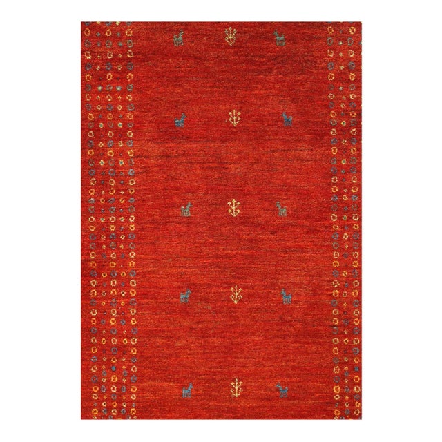Gabbeh rugs are made by the nomadic Qashqai tribes of southern Iran. They are rough cut and long piled rugs of rich color...