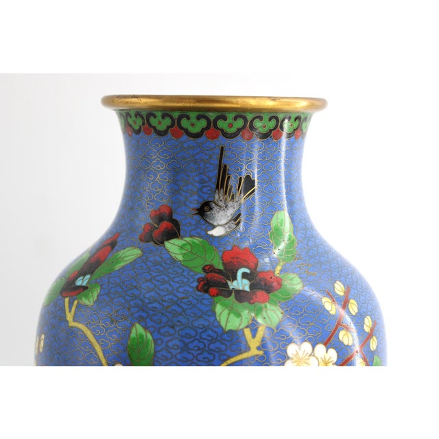 Stunning vintage chinese cloisonne enamel over brass vase. This piece features a rich cobalt blue enamel background...