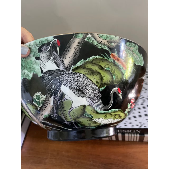 Absolutely stunning and dramatic Asian bowl, presented in a deep dark midnight black with scenes depicting, red head,...