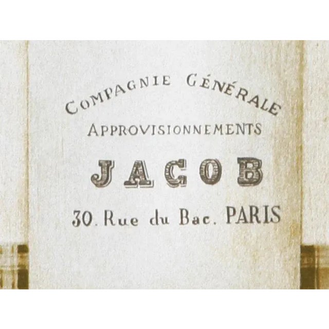 Filled with a series of wildflowers and garden flowers of varying vivid colors, the jar is labelled with the name of a...