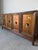 Elegant vintage sideboard in the style of Renzo Rutili, crafted in richly figured walnut with beautifully framed cabinet...