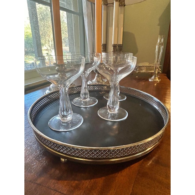 Every home bar or bar cart needs a gallery tray from which to serve or to display your stemware. This tray bears a...