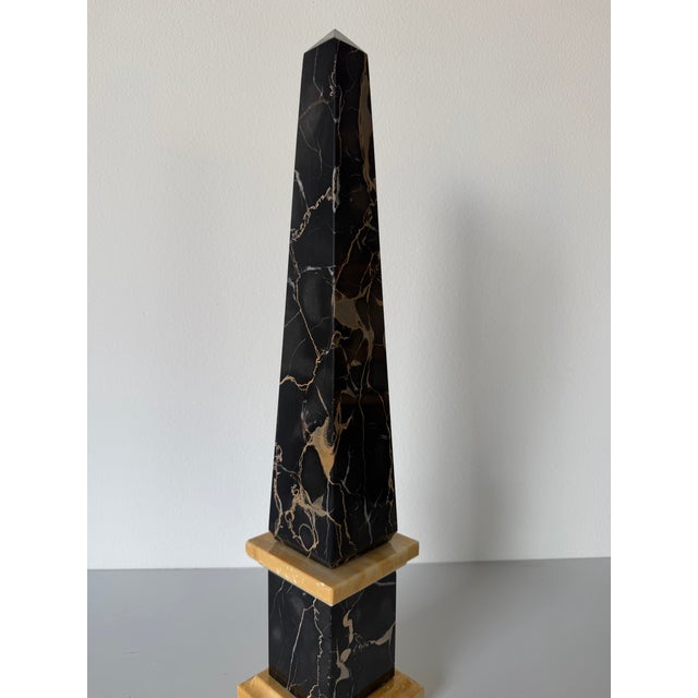 Striking vintage Italian decorative obelisk crafted from polished black Portoro-style marble with dramatic gold and white...