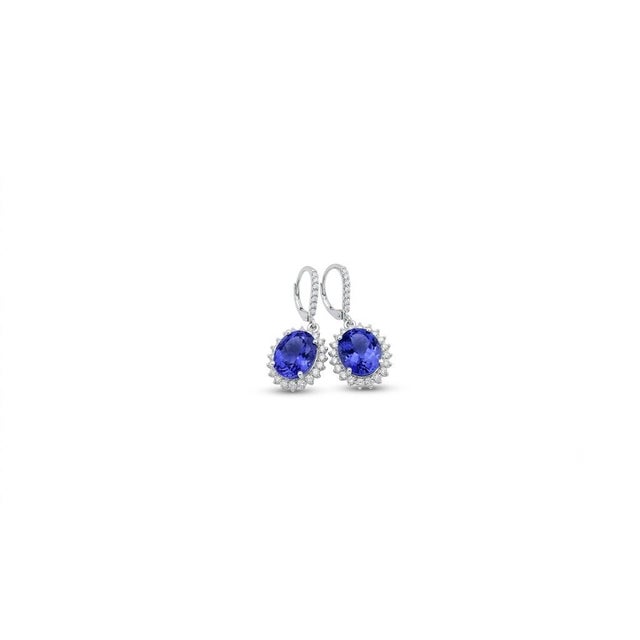 Magnificent 14K white gold drop earrings featuring 10.75 carats total weight of beautifully matched natural oval...