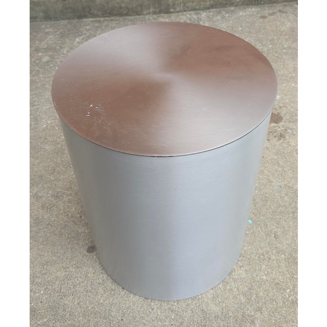 A Modern Brushed Nickel Cylindrical Side Table in great vintage condition. Measures 16.5 in diameter and stands 20" tall.