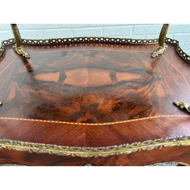 French Provincial Style Two Tier Brass Kingwood Inlaid Occasional Table. Two tỉer table with gilt bronze mounted marquetry...