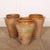 Early 20th century Spanish terracotta vase with traces of an old yellow glaze. Signs of historical damage to one of the...