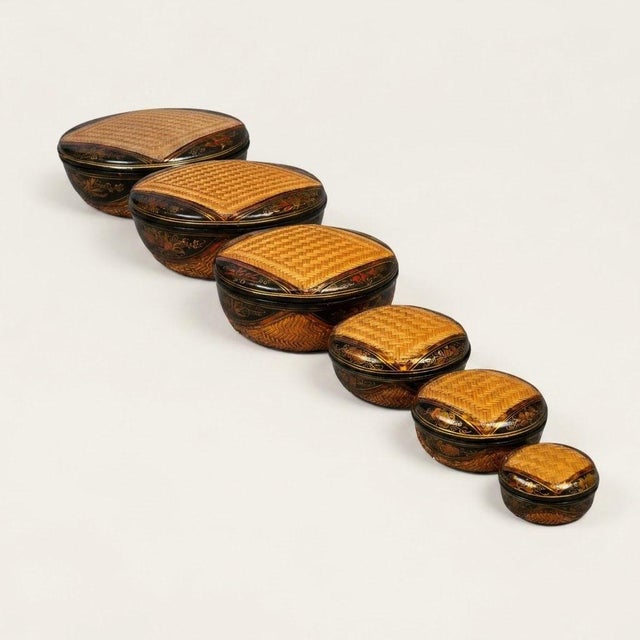 Immerse yourself in the timeless elegance of Southeast Asian craftsmanship with this stunning complete set of six nesting...