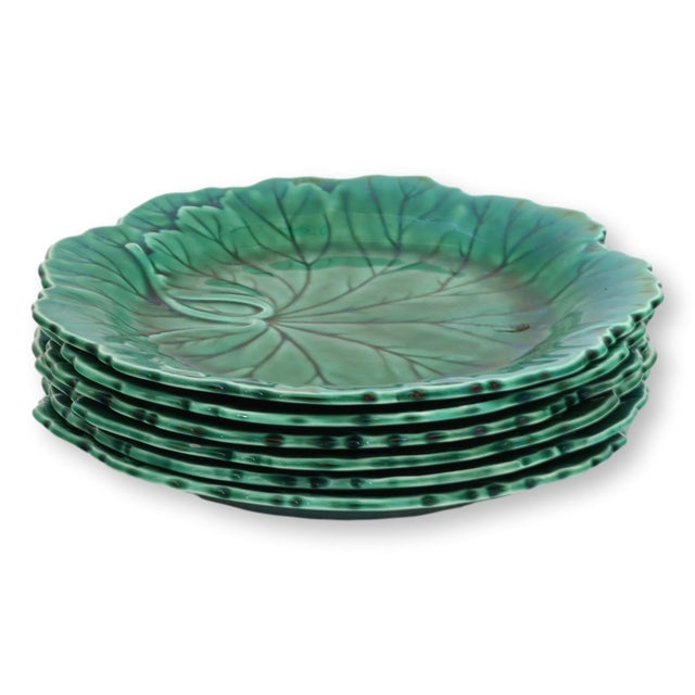 Set of six mid 20th century Wedgwood majolica plates in a richly glazed green coloration, molded in the form of...