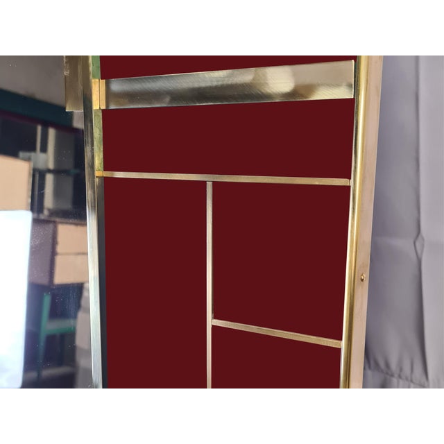 This exquisite Cartier red Murano glass mirror, made in Italy, embodies modern elegance with its Murano glass panels...