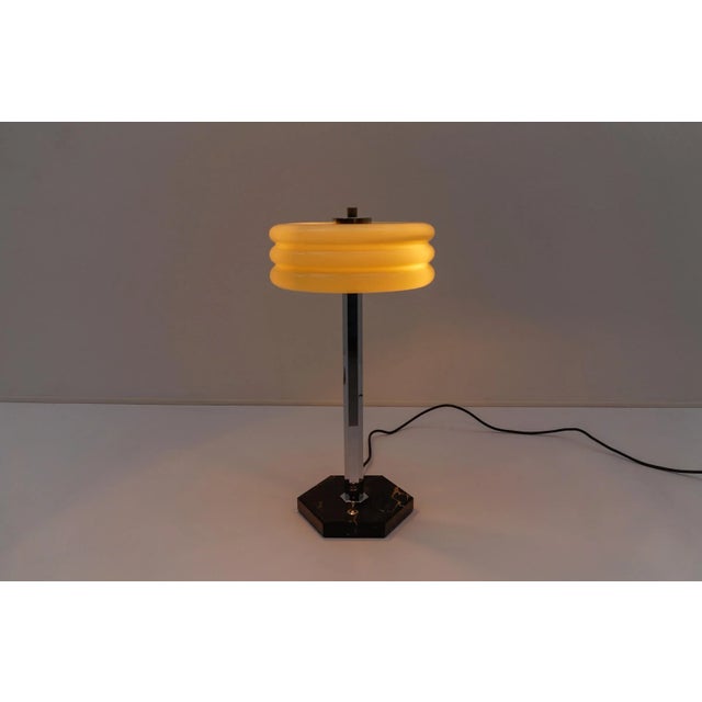 Art Deco Chrome Table Lamp with Glass Shade and Marble Base, 1940s, Germany Executed in massive brass, the lamp comes with...