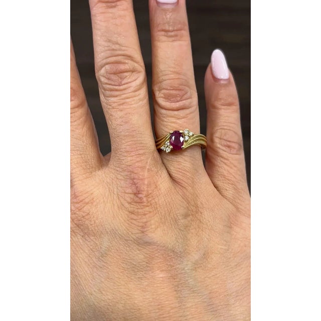 This stunning oval-shaped ring is crafted from 14k yellow gold and features a gorgeous 0.93 carat red ruby as its main...