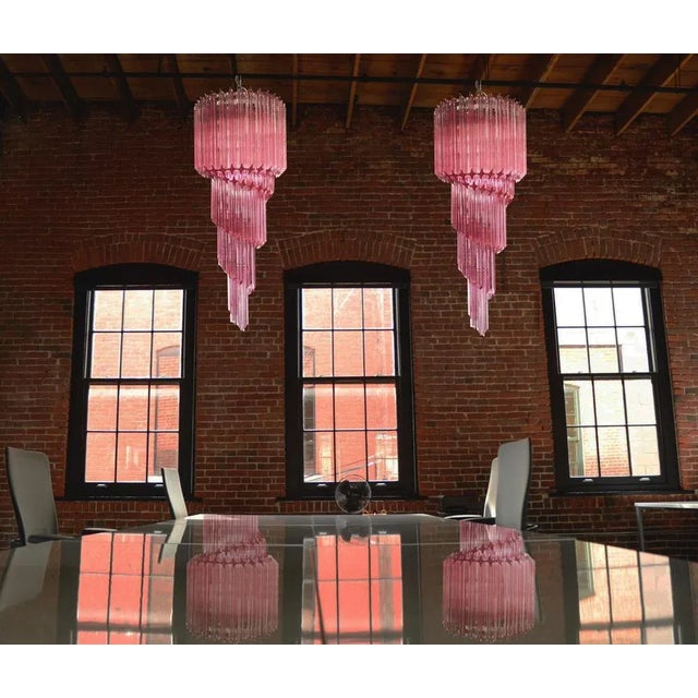 Fantastic pair of Murano chandeliers made by 86 Murano crystal pink prism in a nickel metal frame. The shape of this...