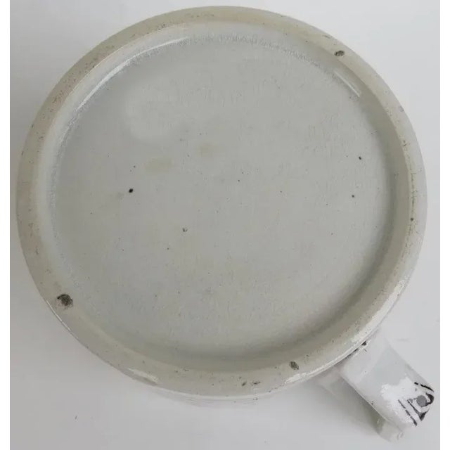 Transfer ware English mug with delightful scene of steam engine train. Decorated on inside and handle. 4" tall 5 1/2" wide.