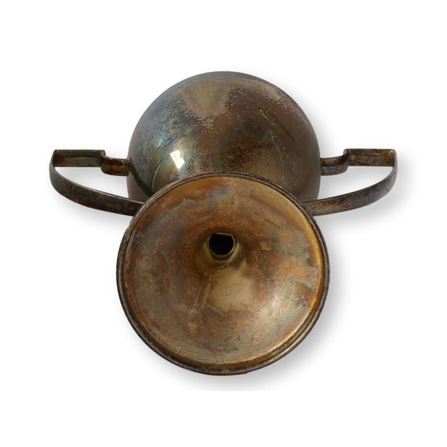 Early 20th century English Courage Challenge Cup trophy with classic twin handle form and pedestal base. The engraved...