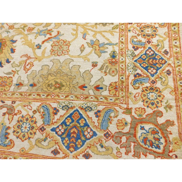 Large, stylized flowers on soft ivory field within ivory border. Wool pile on cotton foundation. A rare find.