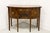 A Hepplewhite style bowfront sideboard by Wright Table Company, from their 18th Century Adaptations. Inlaid flame...