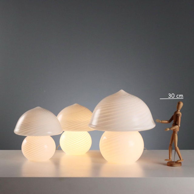 Set of table lamps with a charming mushroom shape, made of white and transparent Murano glass. This piece is attributed to...