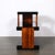 This striking Art Deco Machine Age Three-Tier Black Lacquer & Walnut Side Table originated in the United States, circa...